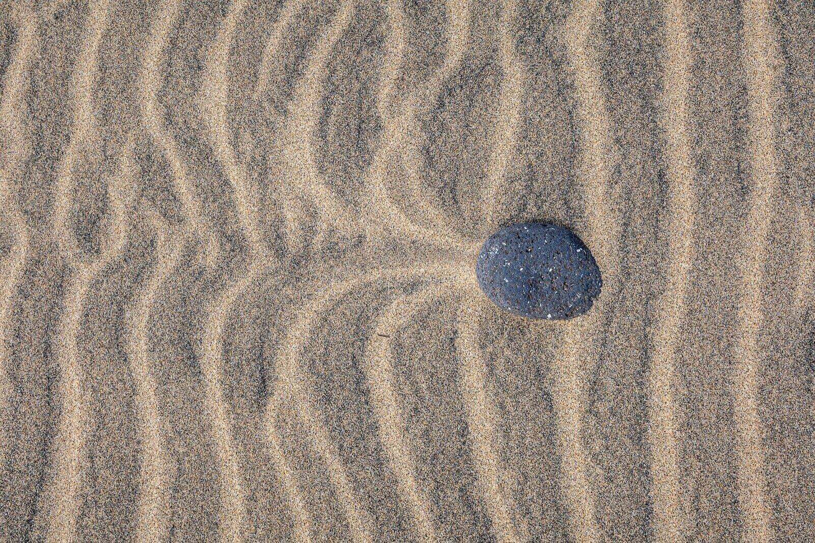 Structures with different colored sand on the beach of Morro Jable, Fuerteventura, Spain