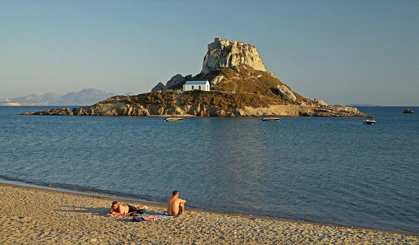 Kefalos beach. Castri island and chapel of St. Nicholas. Kos, Greece