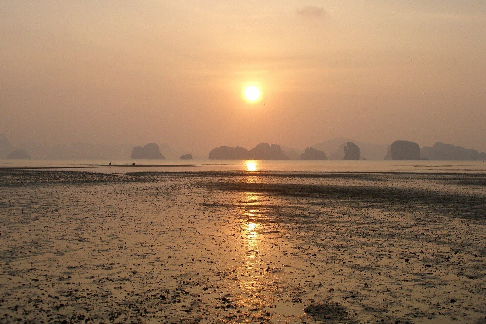 Dreamy ethereal sunrise on the shores of tropical Koh Yao Noi island. The islands of Krabi
